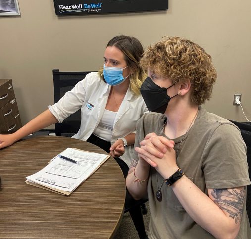 Carlie Forsythe reviewing a hearing test with a client
